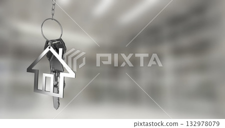 Hanging silver keys on short chain in real estate office, with house-shaped metal keychain 132978079