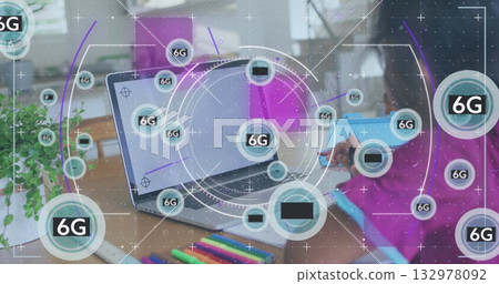 Writing girl in pink shirt studying at home desk, with laptop markers, 6G overlays, copy space 132978092