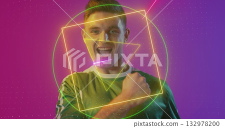 Man in green-white jersey pumping fist and smiling in studio, neon shapes and dotted-grid overlay Man in green-white jersey pumping fist and smiling in studio, neon shapes and dotted-grid overlay 132978200