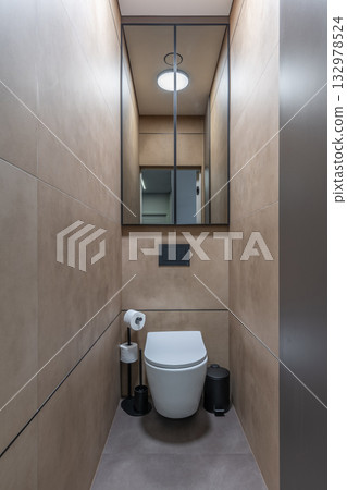 Modern Minimalist Toilet Interior with Beige Ceramic Walls Modern Minimalist Toilet Interior with Beige Ceramic Walls 132978524