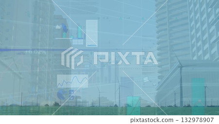 Displaying semi transparent charts overlaying wind turbines on grassland, urban skyline background 132978907