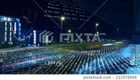 Displaying urban highway with blurred red light trails by street lamps at night with data overlays 132978998