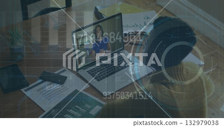 Sitting woman wearing sweater participating in meeting at home desk with laptop, charts, copy space Sitting woman wearing sweater participating in meeting at home desk with laptop, charts, copy space 132979038