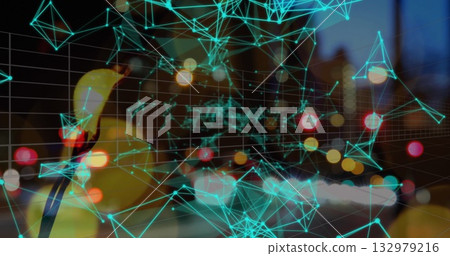 Glowing turquoise network mesh pulsing across nighttime city street, with yellow duck silhouette 132979216