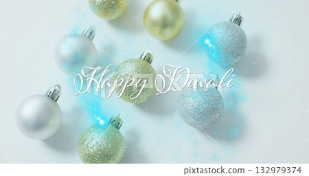 Displaying glittery spherical ornaments and Happy Diwali text overlay in studio, with glitter dust Displaying glittery spherical ornaments and Happy Diwali text overlay in studio, with glitter dust 132979374