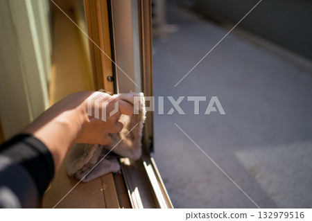 Housewife cleaning windows 132979516