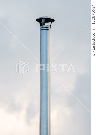 metal round chimney on the background of the sky metal round chimney on the background of the sky 132979554