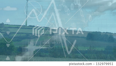 Displaying white wind turbine standing over hedgerows and rolling fields, overlaying line charts Displaying white wind turbine standing over hedgerows and rolling fields, overlaying line charts 132979951