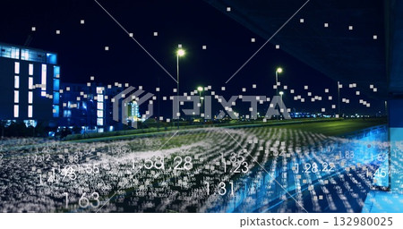 Displaying floating data over overnight highway under overpass, with streetlights and lit buildings Displaying floating data over overnight highway under overpass, with streetlights and lit buildings 132980025