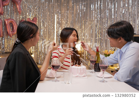 Group of Friends Celebrating Birthday Party with Cake and Gifts Group of Friends Celebrating Birthday Party with Cake and Gifts 132980352