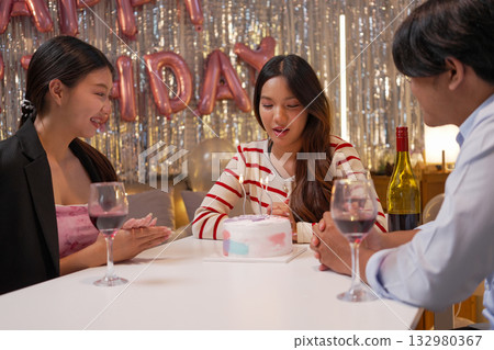 Group of Friends Celebrating Birthday Party with Cake and Gifts 132980367