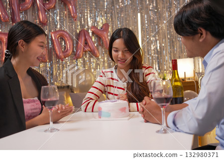Group of Friends Celebrating Birthday Party with Cake and Gifts Group of Friends Celebrating Birthday Party with Cake and Gifts 132980371