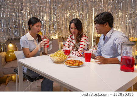 Group of Friends Celebrating Birthday Party with Cake and Gifts Group of Friends Celebrating Birthday Party with Cake and Gifts 132980396