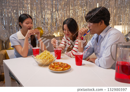Group of Friends Celebrating Birthday Party with Cake and Gifts Group of Friends Celebrating Birthday Party with Cake and Gifts 132980397