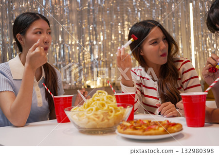 Group of Friends Celebrating Birthday Party with Cake and Gifts Group of Friends Celebrating Birthday Party with Cake and Gifts 132980398