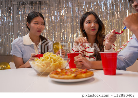 Group of Friends Celebrating Birthday Party with Cake and Gifts Group of Friends Celebrating Birthday Party with Cake and Gifts 132980402