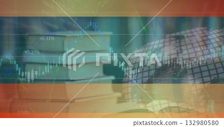Showing stack of hardcover books, open book and grid globe on desk, overlaying financial charts 132980580