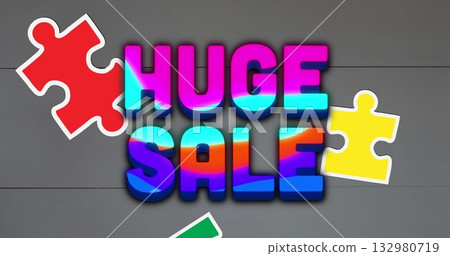 Showing 3D gradient letters spelling HUGE SALE on gray planks, with red yellow green puzzle pieces 132980719