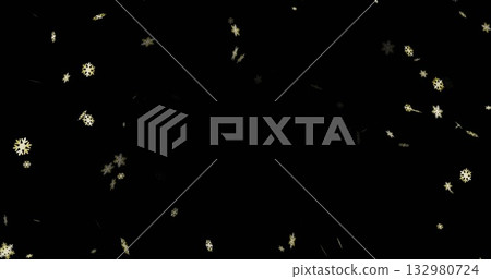 Floating golden snowflake-shaped particles drifting gently against dark backdrop, festive confetti 132980724