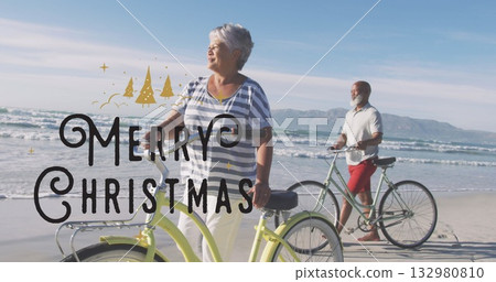 Couple walking cruiser bicycles along beach shoreline with yellow and mint-green bikes, copy space Couple walking cruiser bicycles along beach shoreline with yellow and mint-green bikes, copy space 132980810