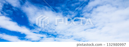 A simple landscape of blue sky and clouds A simple landscape of blue sky and clouds 132980997