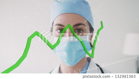 Doctor wearing mask monitoring digital chart overlay in clinic hallway, with stethoscope Doctor wearing mask monitoring digital chart overlay in clinic hallway, with stethoscope 132981363