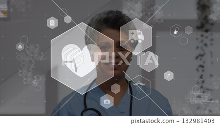 Displaying woman in light blue scrubs with stethoscope and showing health icons in clinic corridor 132981403