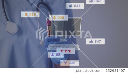 Holding blood tube with purple cap, nurse in blue scrubs with stethoscope using icons in lab Holding blood tube with purple cap, nurse in blue scrubs with stethoscope using icons in lab 132981407