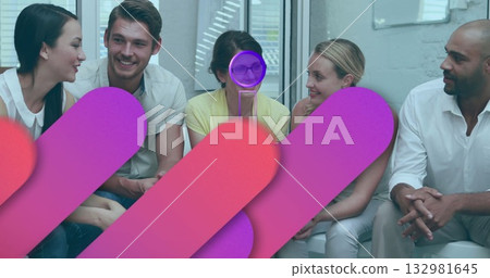 Sitting five coworkers in business casual conversing on bench by window, with glass disc award 132981645