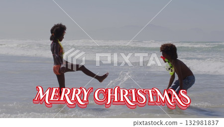 Splashing siblings playing in shallow ocean water, with bikini striped swim trunks and snorkel mask Splashing siblings playing in shallow ocean water, with bikini striped swim trunks and snorkel mask 132981837