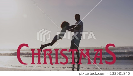 Swinging man lifting child girl by hands at beach shoreline, with wet sand reflection, ocean waves Swinging man lifting child girl by hands at beach shoreline, with wet sand reflection, ocean waves 132981840