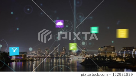 Displaying network icons above harbor skyline at night, with cloud and wifi icons and light beam 132981859