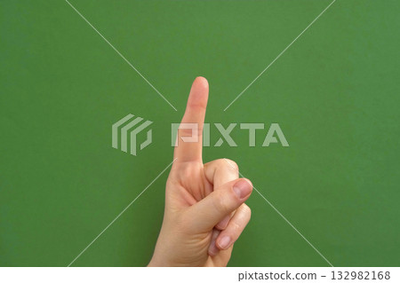 Female hand making warning gesture on Chroma key. Human hand showing her denial with index finger motion isolated on green. Stop sign, refusal, caution. Preventing subsequent problems. Body language Female hand making warning gesture on Chroma key. Human hand showing her denial with index finger motion isolated on green. Stop sign, refusal, caution. Preventing subsequent problems. Body language 132982168