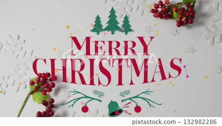 Showing bold red Merry Christmas greeting on white tabletop, with pine icons, berry sprigs Showing bold red Merry Christmas greeting on white tabletop, with pine icons, berry sprigs 132982286