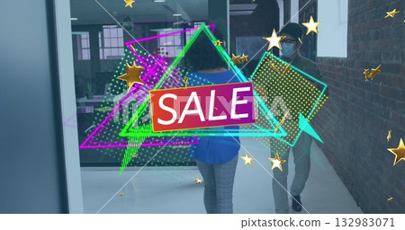 Floating digital neon SALE overlay across office corridor, with masked coworker in blue blouse 132983071