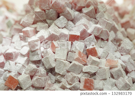 Closeup of pink Turkish delight cubes dusted with powdered sugar Closeup of pink Turkish delight cubes dusted with powdered sugar 132983170