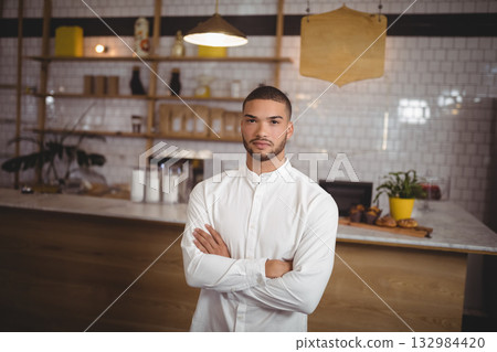 man, arms crossed, barista 132984420