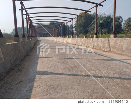 Under-construction road underpass with visible iron roof frame awaiting plastic sheet covering, captured during urban development in India Under-construction road underpass with visible iron roof frame awaiting plastic sheet covering, captured during urban development in India 132984440
