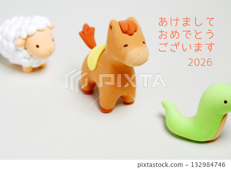 New Year's card with a row of horses and sheep, horizontal, with a greeting and the year's name 132984746