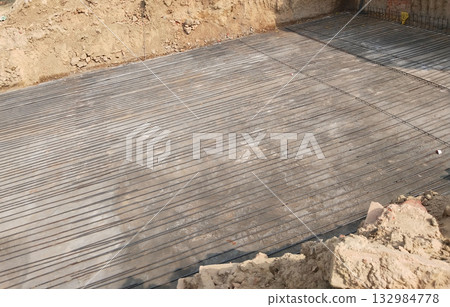 New Bridge Construction Site with Steel Reinforcement and Dug Earth Reflecting Rural Infrastructure Development Under Open Sky with Tractor and Worker in a Village Setting with Natural Surroundings New Bridge Construction Site with Steel Reinforcement and Dug Earth Reflecting Rural Infrastructure Development Under Open Sky with Tractor and Worker in a Village Setting with Natural Surroundings 132984778