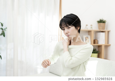 A young woman with stiff shoulders A young woman with stiff shoulders 132985928