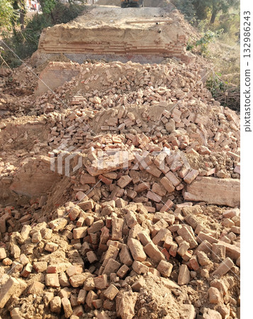 Demolished Old Bridge with Scattered Bricks and Earth Preparing for New Construction Reflecting Rural Development and Modern Engineering Under Open Sky with Vegetation and Future Infrastructure Plans Demolished Old Bridge with Scattered Bricks and Earth Preparing for New Construction Reflecting Rural Development and Modern Engineering Under Open Sky with Vegetation and Future Infrastructure Plans 132986243