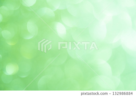 Light green colored large and small bokeh glitter background material Light green colored large and small bokeh glitter background material 132986884