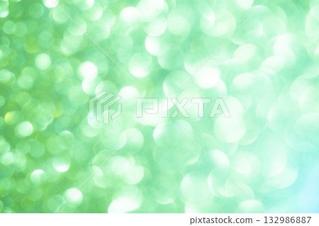 Light green colored large and small bokeh glitter background material Light green colored large and small bokeh glitter background material 132986887