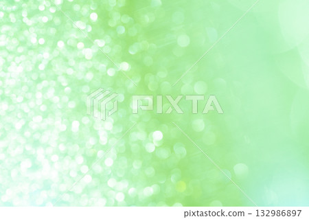 Light green colored large and small bokeh glitter background material 132986897