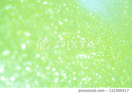 Light green colored large and small bokeh glitter background material 132986917