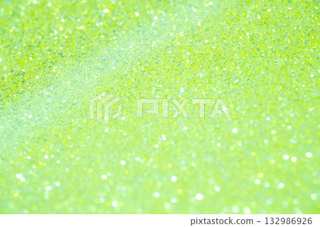 Light green colored large and small bokeh glitter background material 132986926
