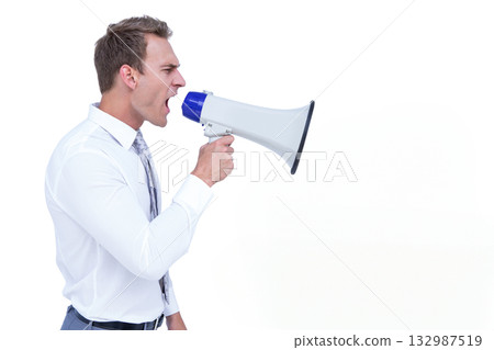 Twentysomething man wearing suit raising white and blue megaphone to mouth in studio, copy space Twentysomething man wearing suit raising white and blue megaphone to mouth in studio, copy space 132987519