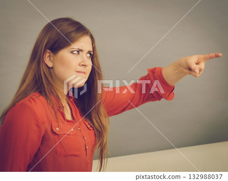 Angry woman sitting on sofa 132988037