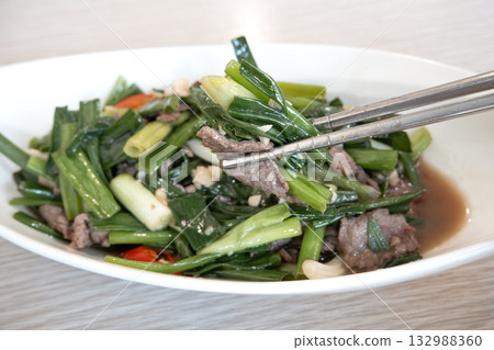 Stir-fried beef with scallions, green onions, leeks, beef. Stir-fried beef with scallions, green onions, leeks, beef. 132988360